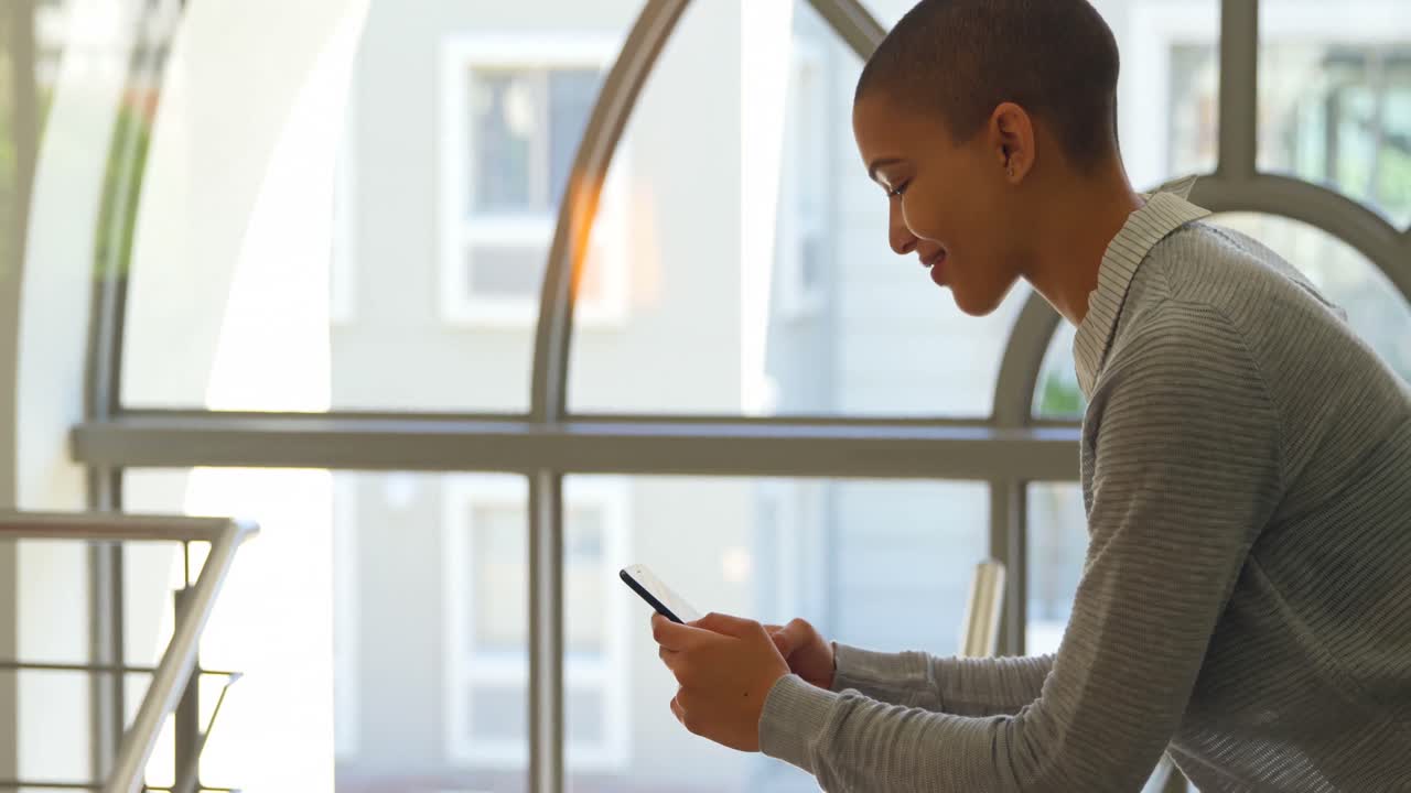 Side view of young caucasian female executive using mobile phone 4k