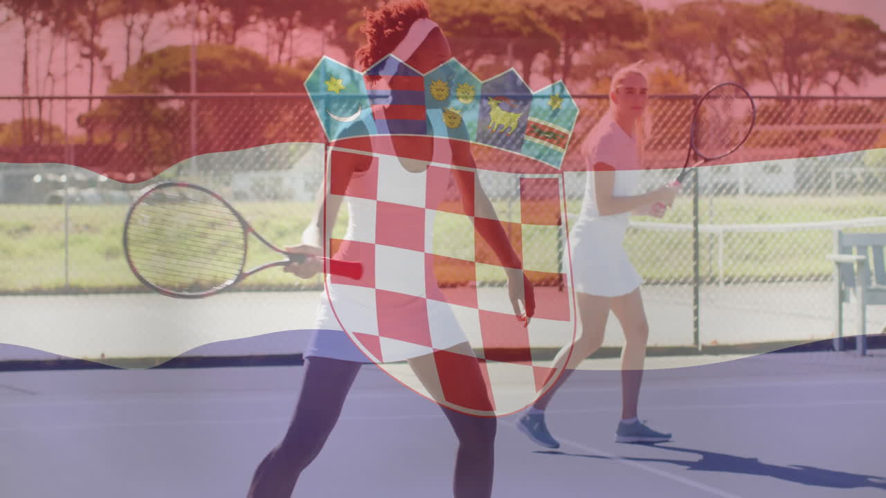 Two women playing tennis doubles on outdoor court, showing sports-themed Croatian crest overlay
