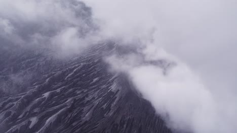 mount bromo vulcano indonesia with smoke during sunrise, aerial