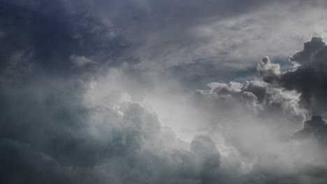 pov lightning flashes inside dark clouds in the sky, thunderstorm