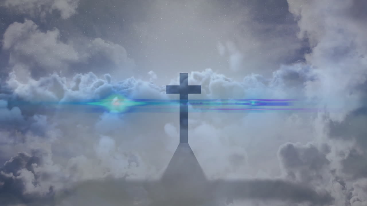 Colorful light beams and ethereal clouds creating animation behind cross silhouette