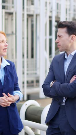 business professionals engaged in outdoor conversation