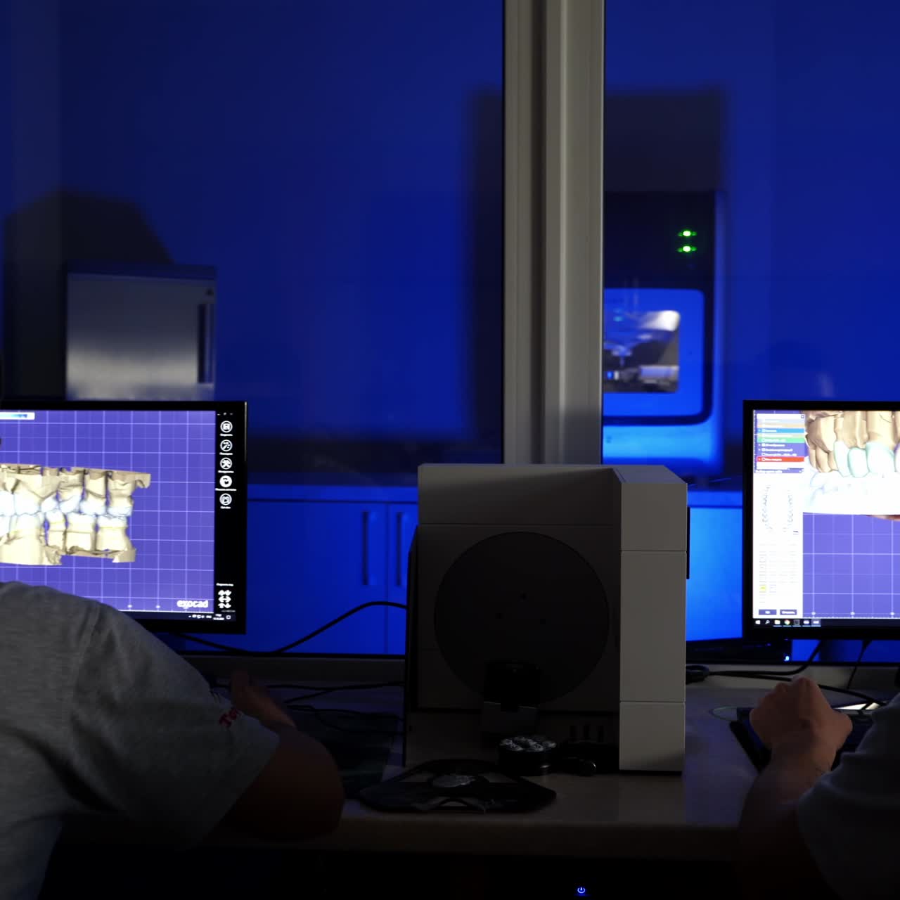 Dental technician works with dental prosthesis. Making of artificial teeth by dental technician in the clinic