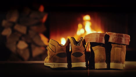 Men's-And-Women's-Winter-Boots-Dry-Near-The-Fireplace-Romantic-Winter-Evening