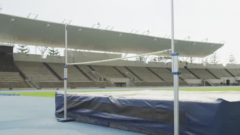 mixed race athlete doing high jump