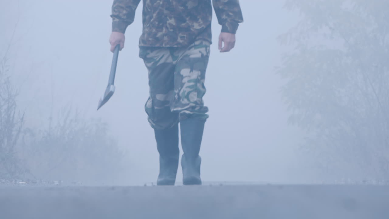 A Murderer With A Bloody Ax On A Forest Road Stands In The Light Of Car Headlights Creepy Crime Scen