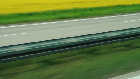 quickly go along the motorway among the green fields