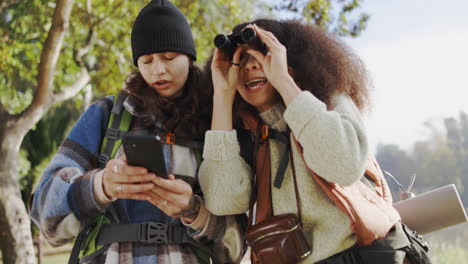 women friends, binoculars and phone for search