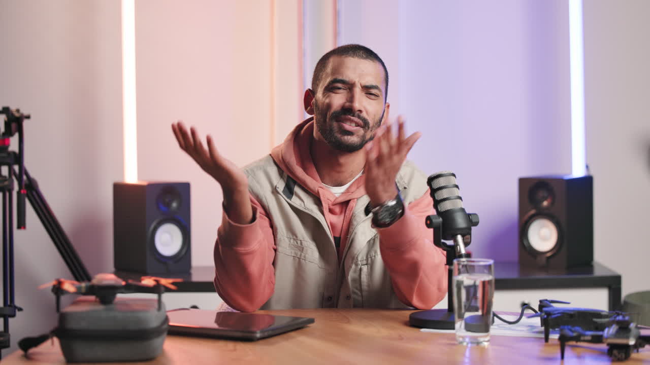 Man recording a podcast in his studio