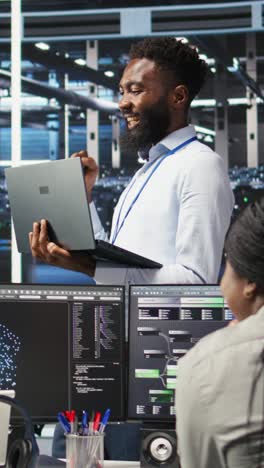 Vertical Video Happy Data Center Admin Using Node Tree Tool Doing High Five With Coworker