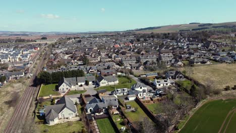 Aerial-view-of-the-Scottish-town-of-Laurencekirk-on-a-sunny-spring-day,-Aberdeenshire,-Scotland