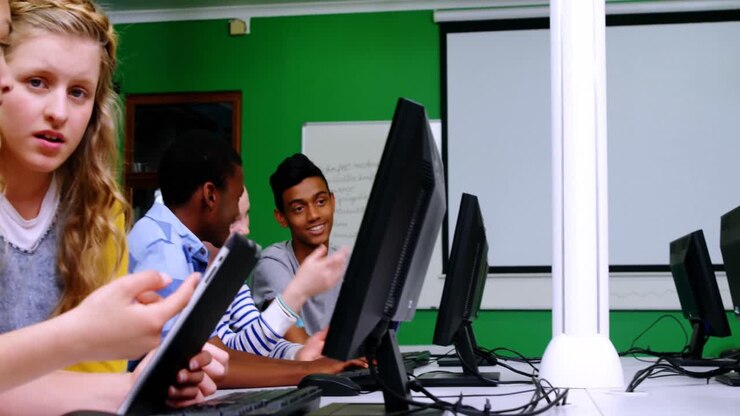 Students studying on computer in classroom
