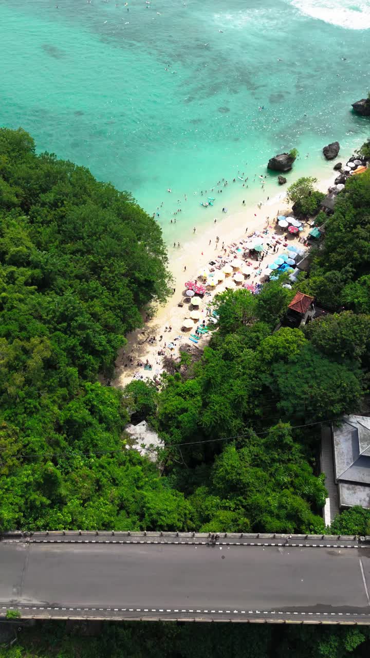 Sandy beach and small bridge in Nusa Penida island, aerial vertical view