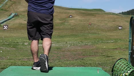 man practicing golf swing in piedmont, italy