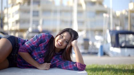 girl lying on a park bench