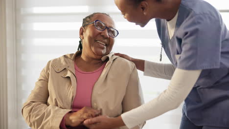 old woman, wheelchair and caregiver holding hands