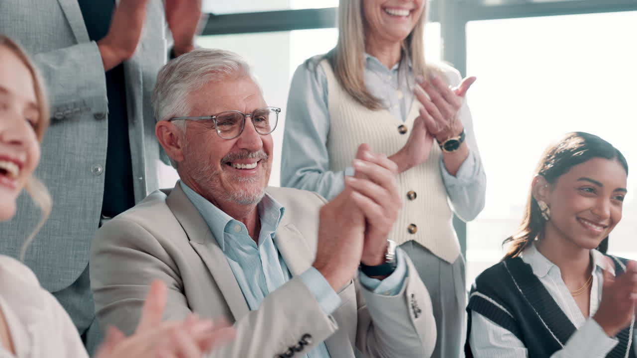 Successful business team celebrating achievement with applause