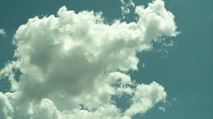 Bright Blue sky with white puffy fluffy cumulus clouds Timelapse of summer weather