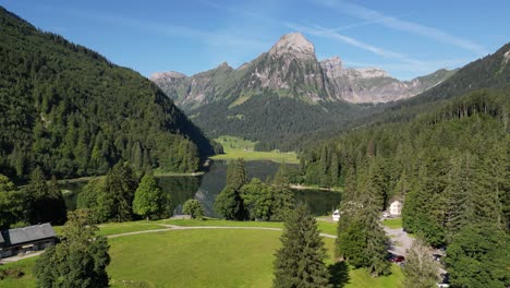 local people in switzerland living in green fresh air natural place in highlands of alpine swiss alps lots of green field and hiking plan to trip to mountain range pine tree forest calm lake nafels