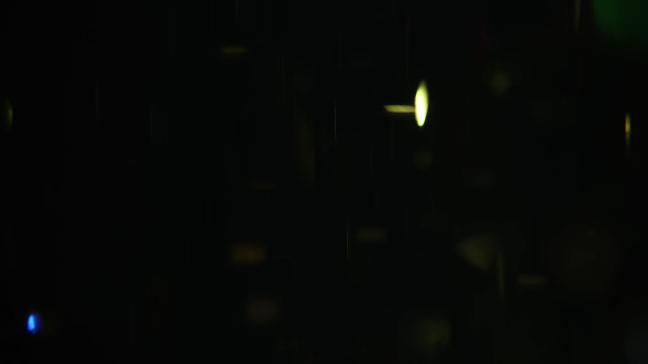 Abstract Light Streaks and Bokeh on Dark Background