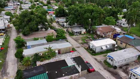 aerial view of a florida trailer park with tree-lined dirt roads