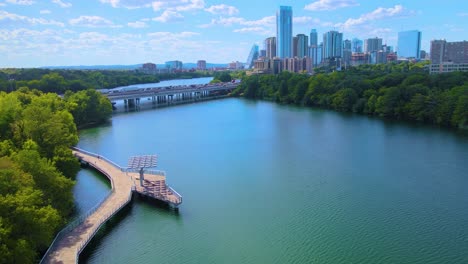 Flying-alongside-the-Boardwalk-on-Lady-Bird-Lake-in-Austin,-Texas