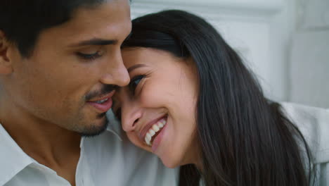 Happy-sweethearts-bonding-evening-street-closeup.-Love-couple-embracing-talking