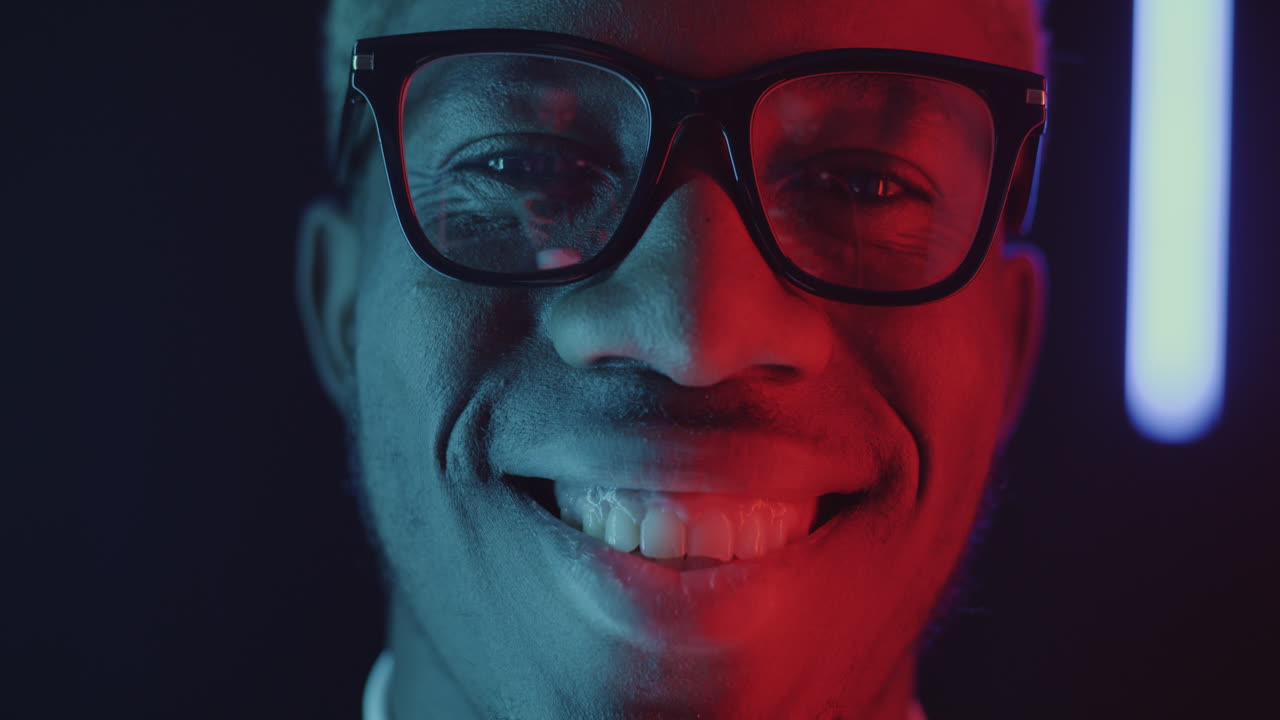 Happy Man with Glasses in Neon Light
