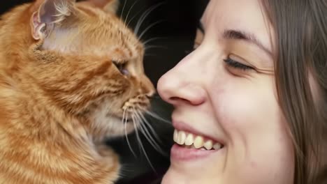 a heartwarming moment between a woman and her adorable ginger cat, capturing the joy and connection that pets bring to our lives in this endearing close-up.