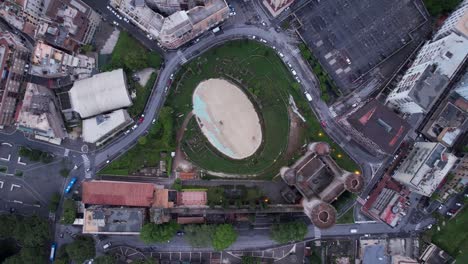 Aerial-rising,-Tivoli-Castle-and-historical-Amphitheatre-ruins-in-Italy