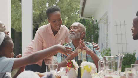 Happy-family-eating-together-at-table