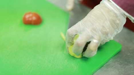 chef hands cutting fruit. chef hands cutting fruit on table in kitchen