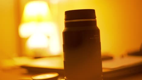 camera lens, vintage look,vintage night lamp in the backgroundwarm and comfy