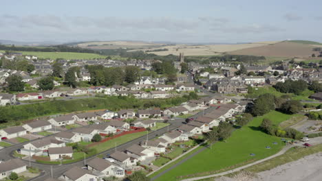 an aerial view of inverbervie looking over the town from the sea on a sunny summer's day