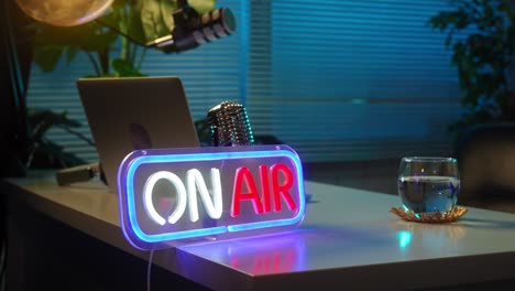 neon on air sign in a professional broadcast studio setup