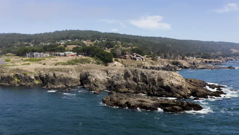 Aerial-pull-back-looking-at-the-rocky-coast-of-Sea-Ranch,-California