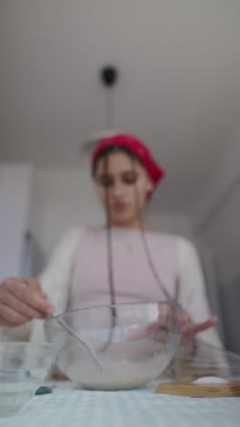 young woman preparing dough