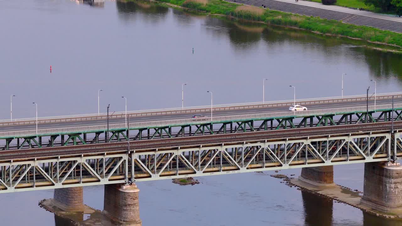 Gdanski Bridge journeys, motorcars crossing water, city infrastructure