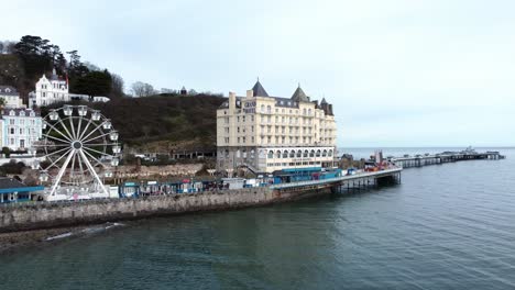 Llandudno-pier-Victorian-promenade-Ferris-wheel-attraction-and-Grand-hotel-resort-aerial-descending-view