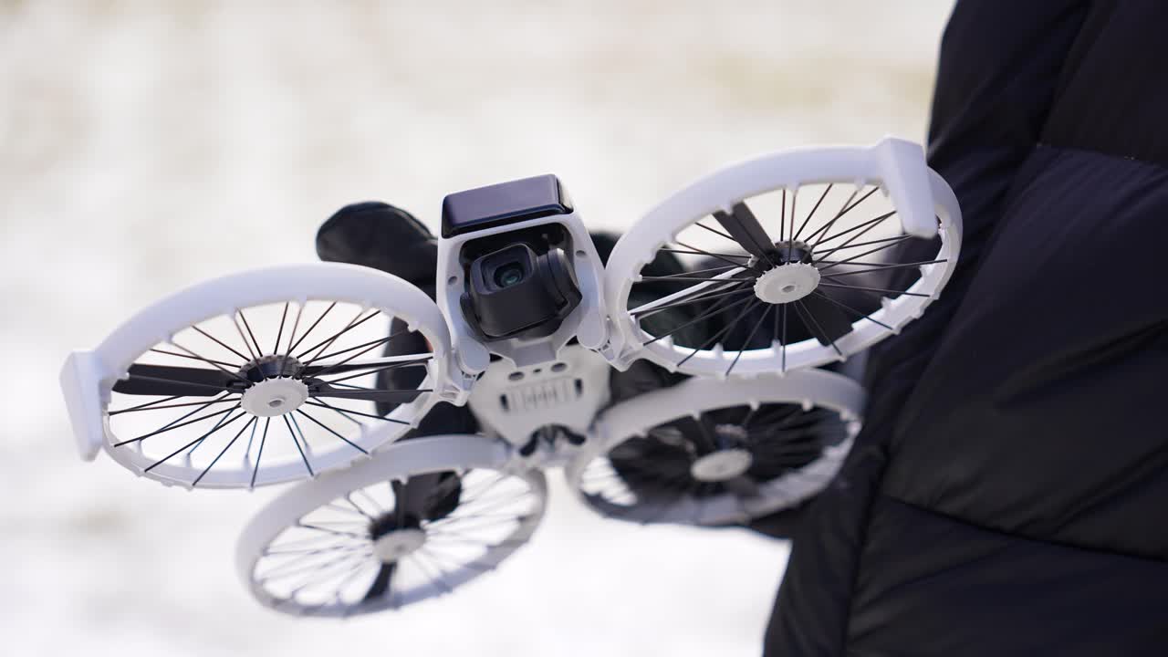 Gloved hands removing protective cover from drone gimbal, Czechia