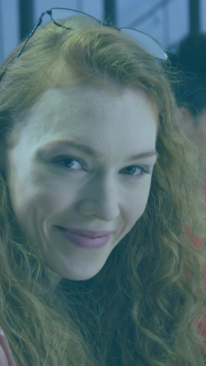 Animation of clouds and percents over diverse female colleagues working in office