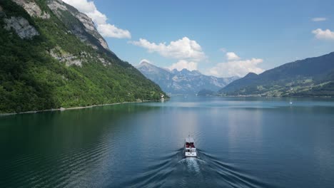 postcard perfect cinematic beauty shot of boat cruise in swiss tourism