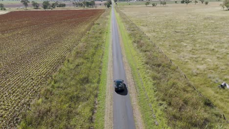 a car travels slowly on a rural road