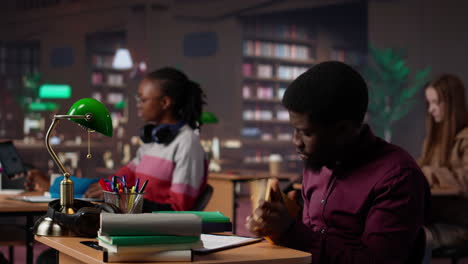 vertical video african american guy highlighting essential handwritten class notes