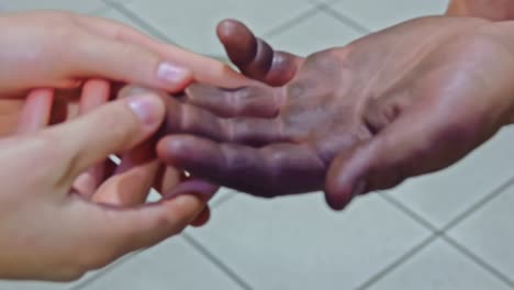 Hands-of-Woman-helps-homeless-man