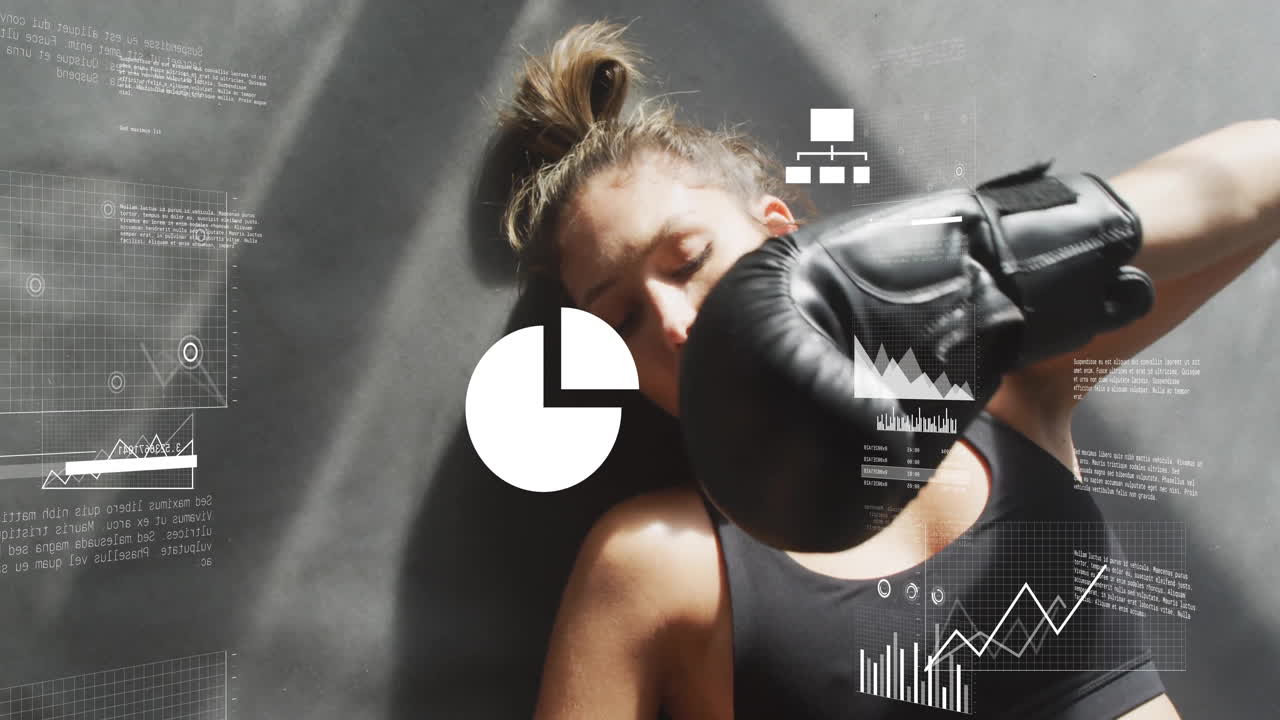 Wearing boxing gloves, woman with animation of data charts in school setting