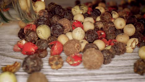 macro close-up mixed peppercorns. dry mix peppercorns close up