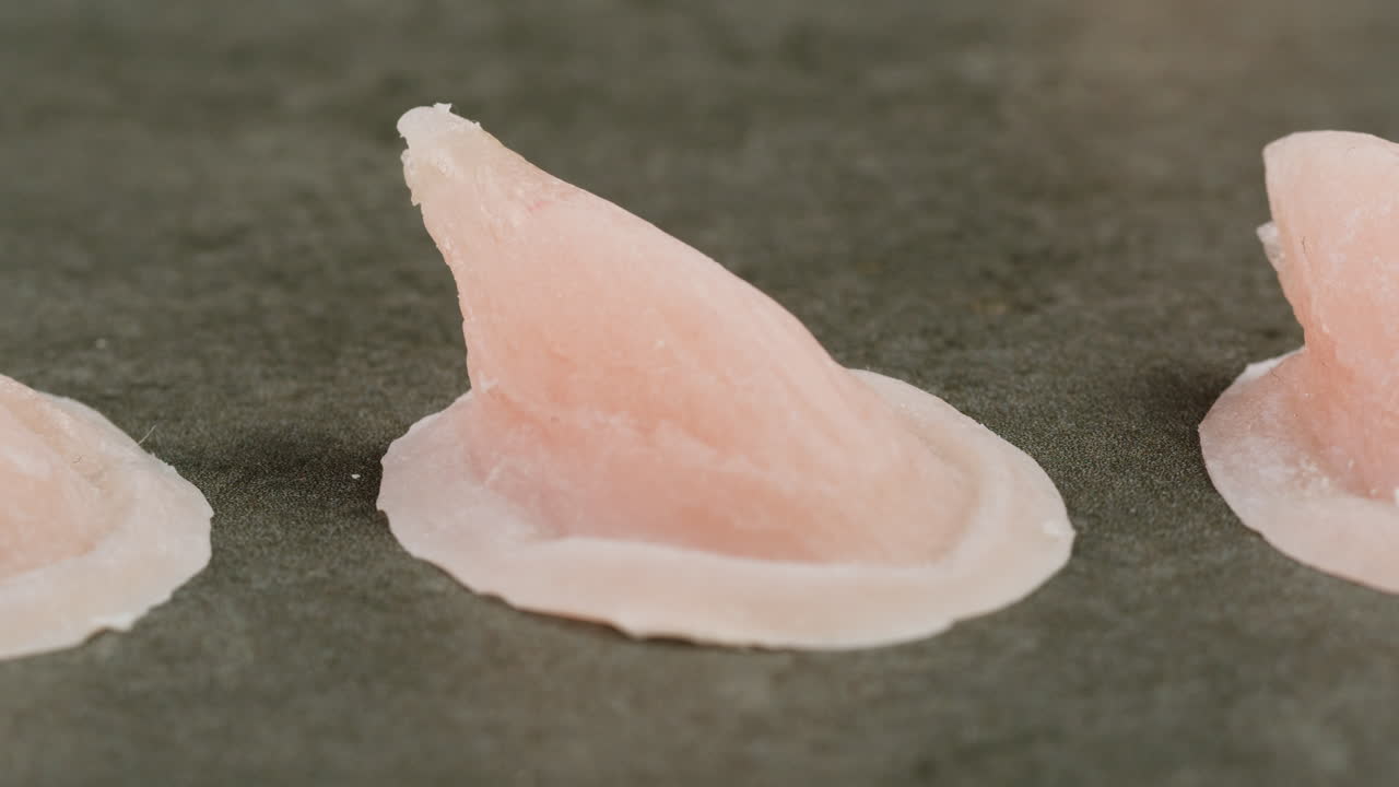 A rubber fake finger with blood close-up. Make-up equipment props for films and shooting. Bloody fake fingers for halloween and parties