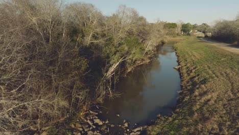 A-late-afternoon-aerial-view-of-a-Horsepen-Bayou-Feeder-before-it-flows-into-the-main-channel-of-Horsepen-Bayou-in-Clear-Lake,-Houston,-Texas