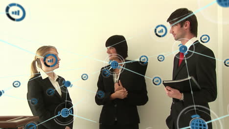 animation of network of digital icons against group of diverse businesspeople discussing at office